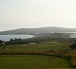 The par-5 15th hole at The New Links at Bodega Harbour plays downhill with the ocean in the distance. 