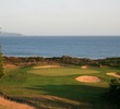 The par-4 18th hole at The New Links at Bodega Harbour requires a delicate approach shot to a green below the fairway.