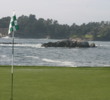 The Pebble Beach Golf Links web site recommends playing it safe by knocking down a short iron and keeping  the ball from ballooning in the wind on the par-3 seventh hole.